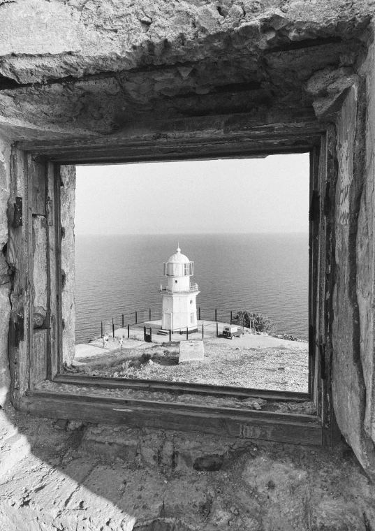 a view of a lighthouse from a window