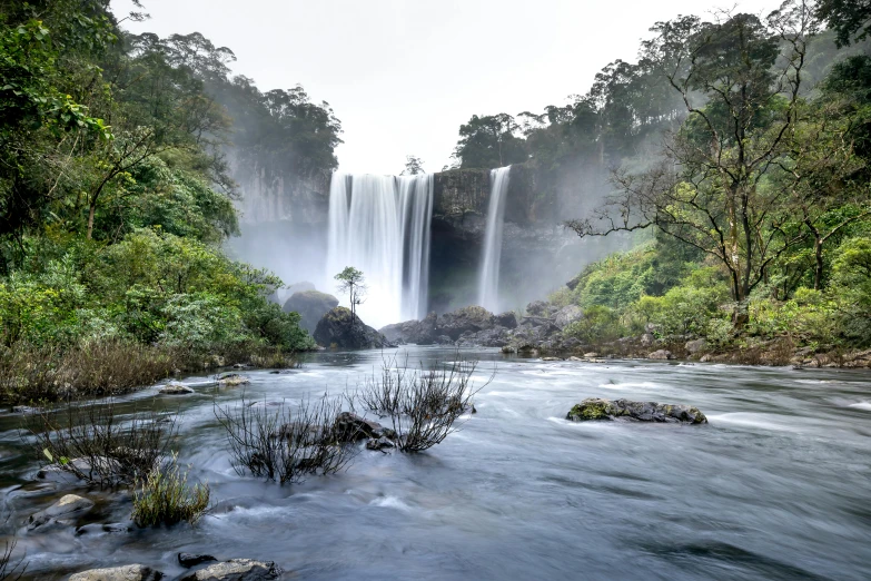 a very tall waterfall with waterfalls in the background