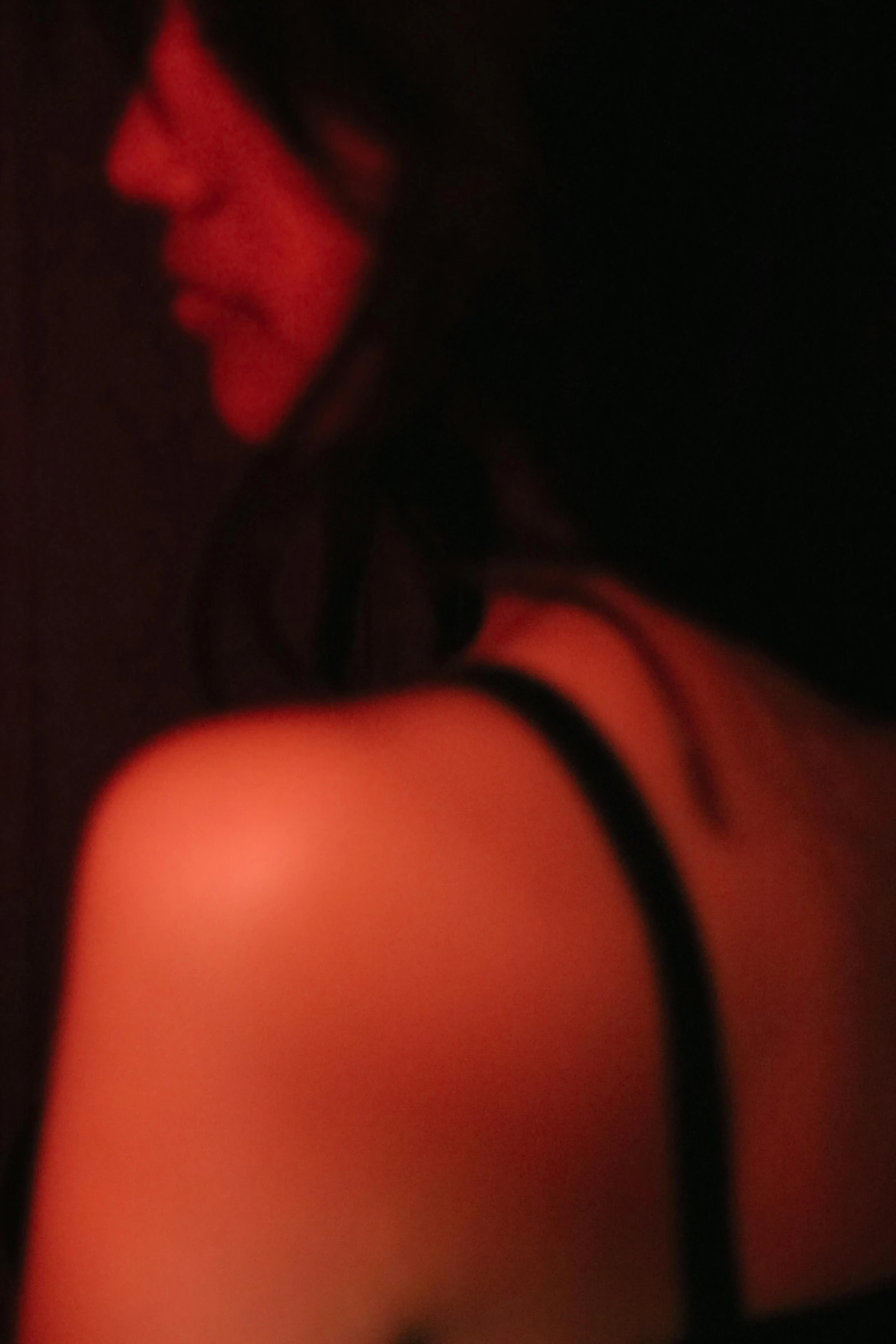 a girl with a cell phone in her hand and an illuminated image