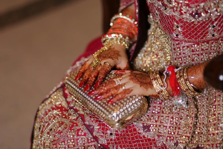 bride holding a purse while standing in front of the camera