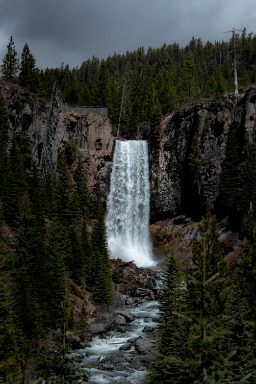 the waterfall is being gushed into the water