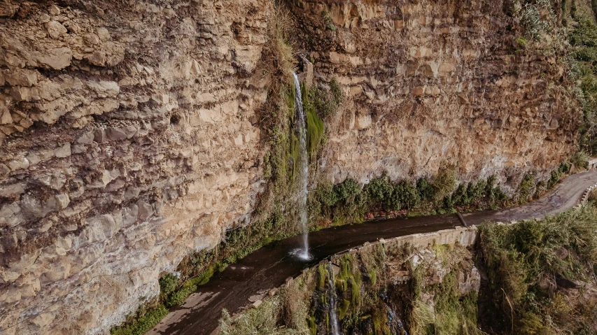 a small waterfall that has been fed out from the ground