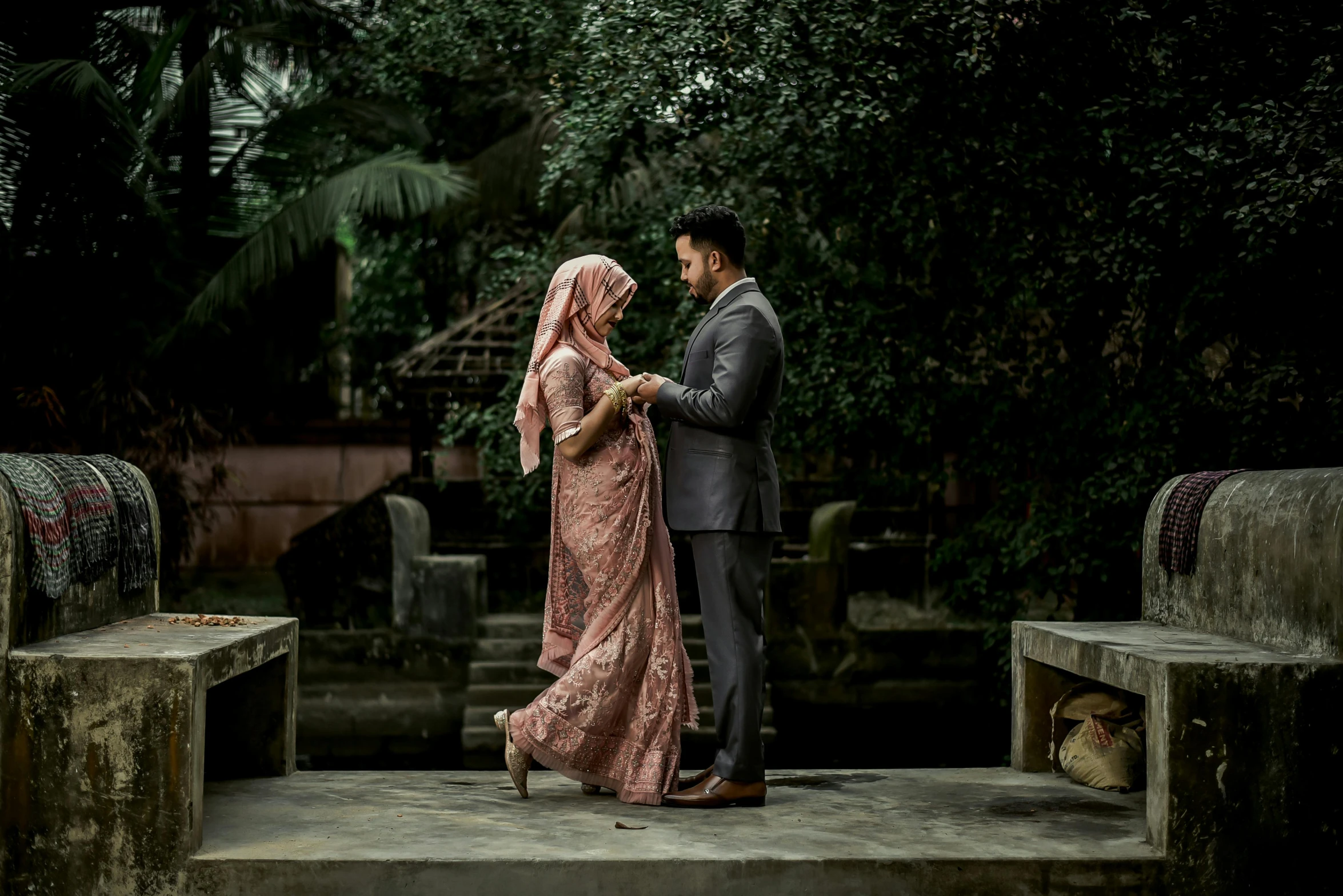 a bride and groom share a moment before getting married