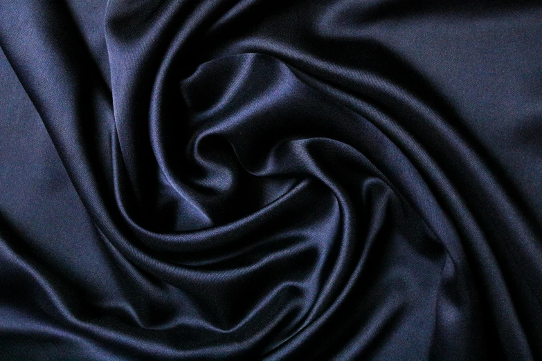a large blue piece of fabric sitting on top of a table