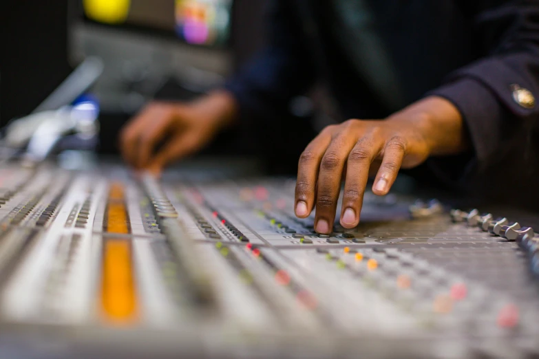 a person using a keyboard while he is recording