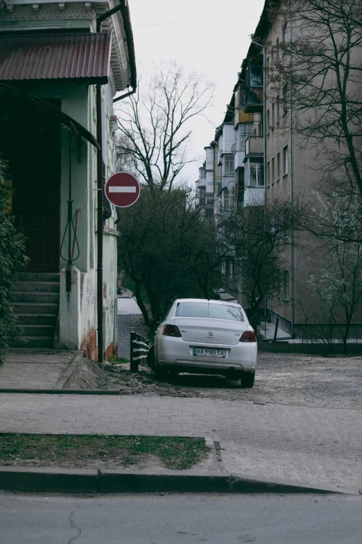 the car is parked outside in front of the house