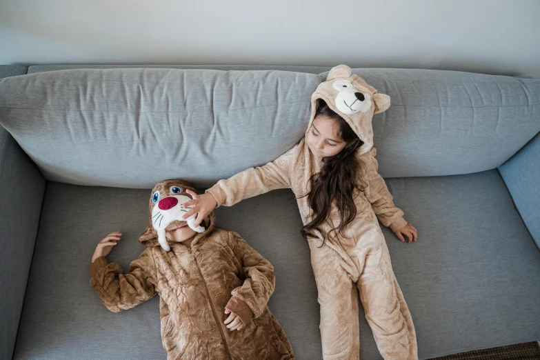 two people on a sofa dressed up for halloween