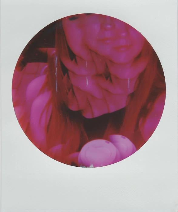 a white and pink circular po of a woman with pink hair