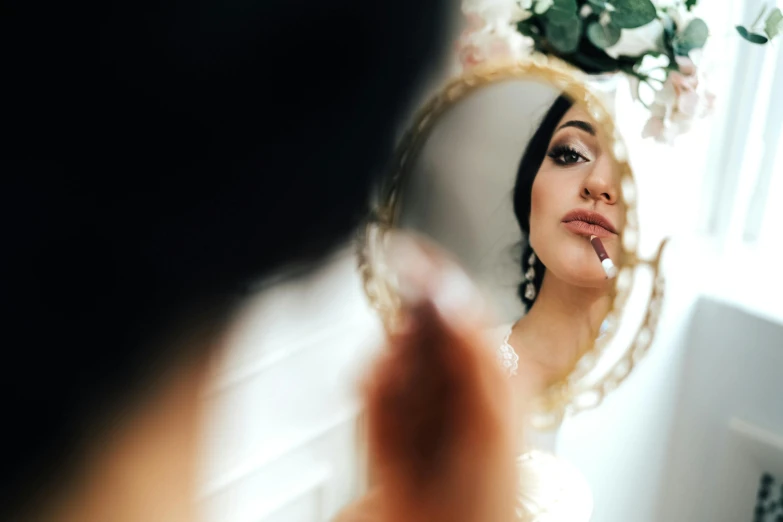 a woman taking her own po in the mirror