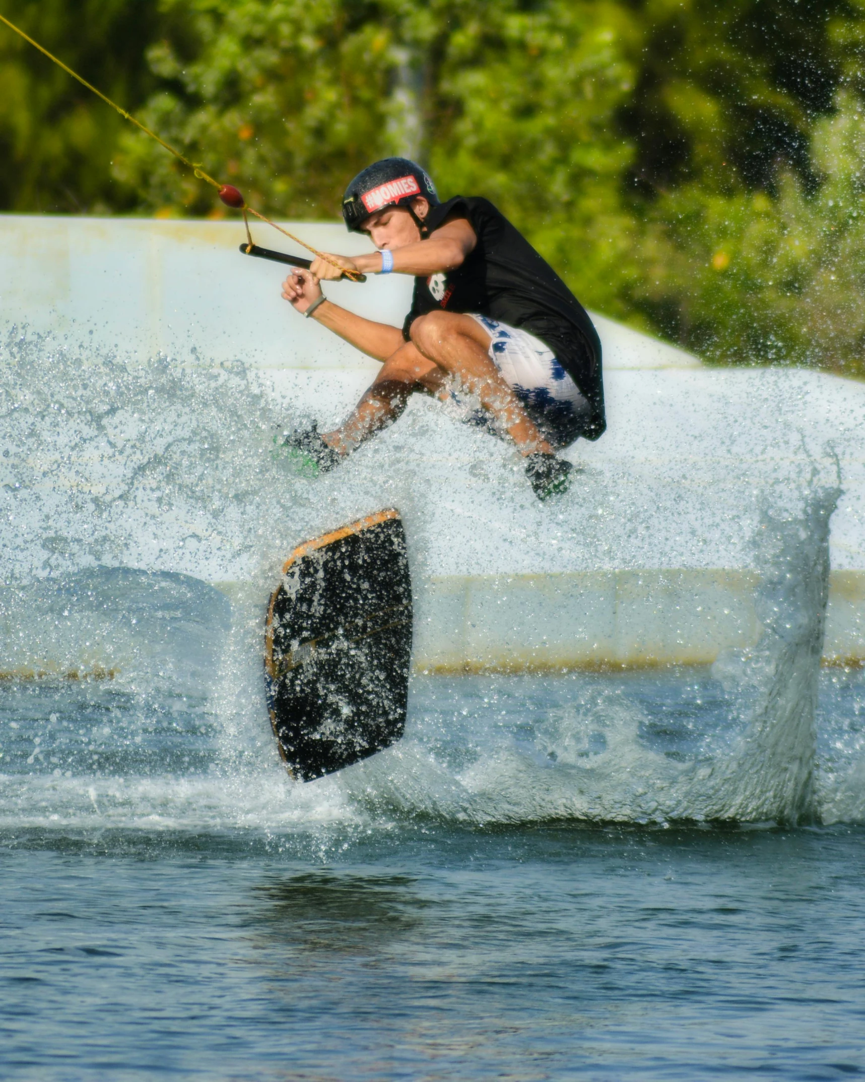 a wake boarder is going over a structure