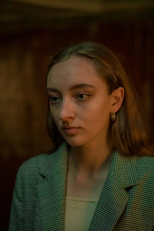 a young woman looks into the distance while looking up