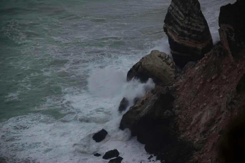 large rocks in the middle of a body of water