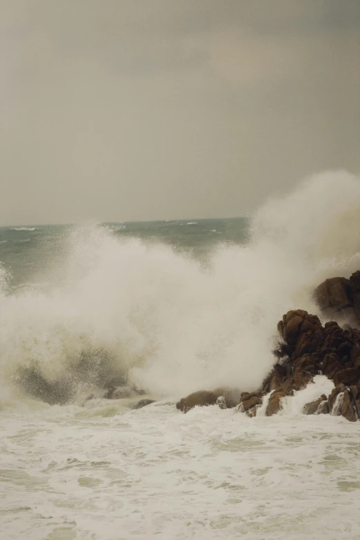 a surfer is surfing on an ocean wave