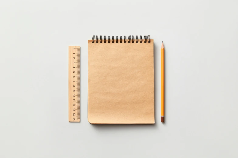 an open notebook with a pencil next to it