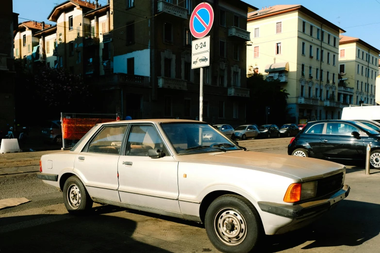 a car parked in front of an apartment building