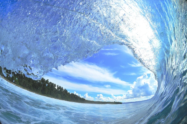 a large wave crest above the top of a body of water