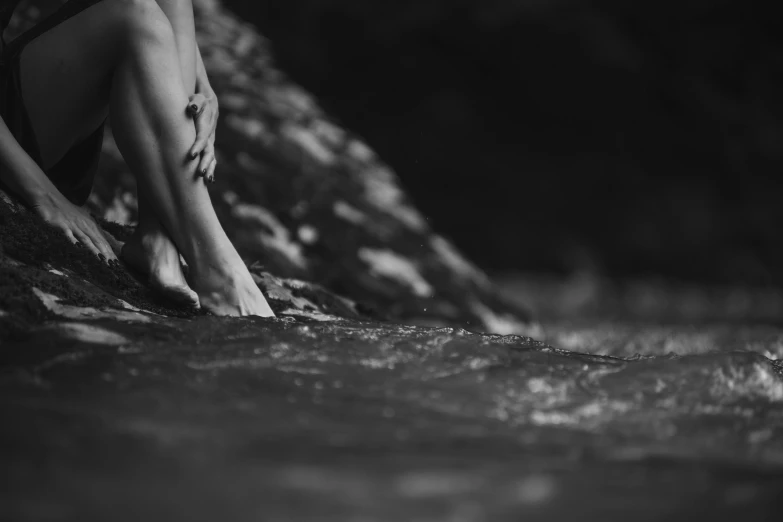 a close - up of a women's foot in water