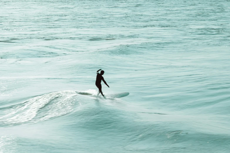 a person that is surfing in the water