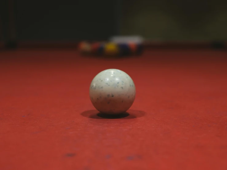 a pool ball sitting on top of a table