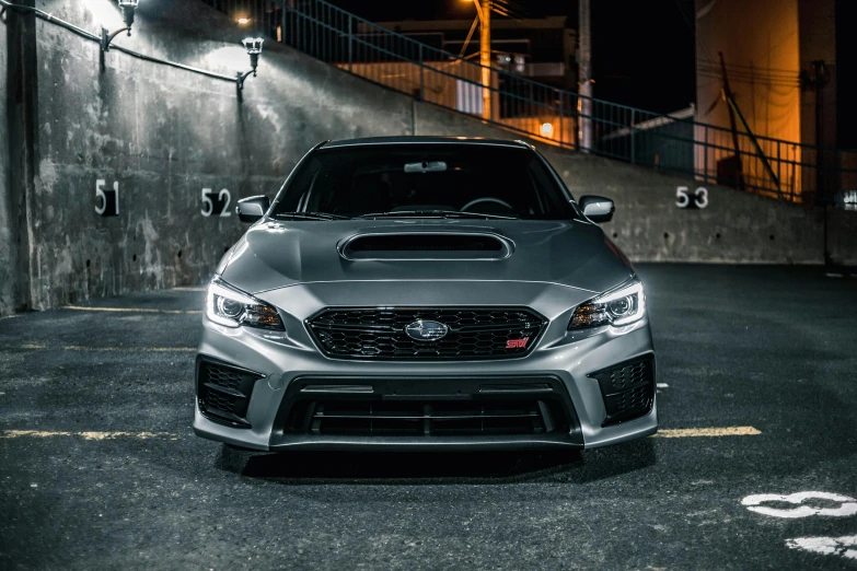 a car parked in a parking lot at night