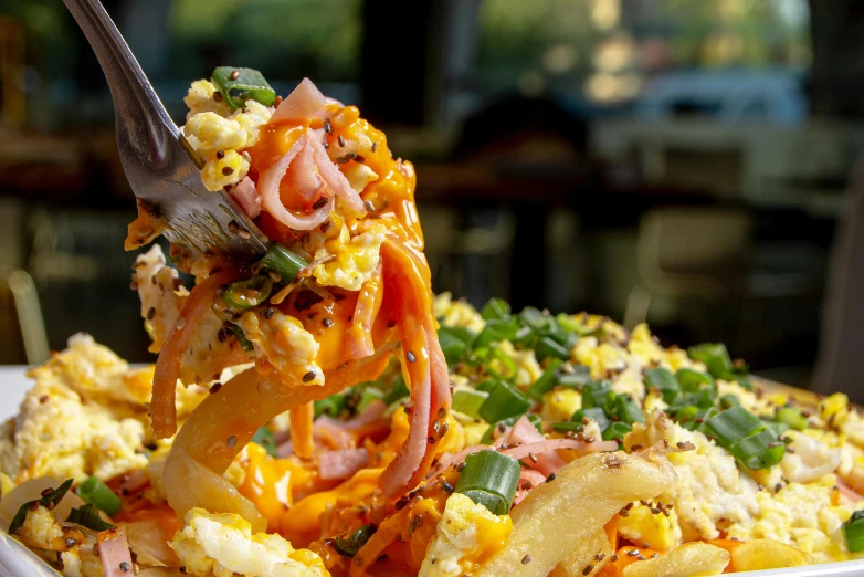 a fork is in a plate full of vegetables