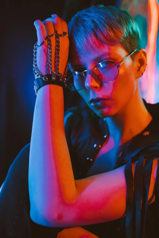 woman in black shirt with metal wrist band