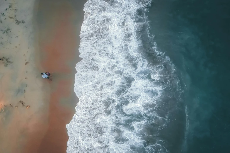 an aerial view of a small boat near the water