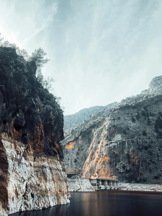 a river near a mountain is surrounded by water