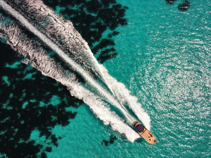 a boat traveling along a large body of water