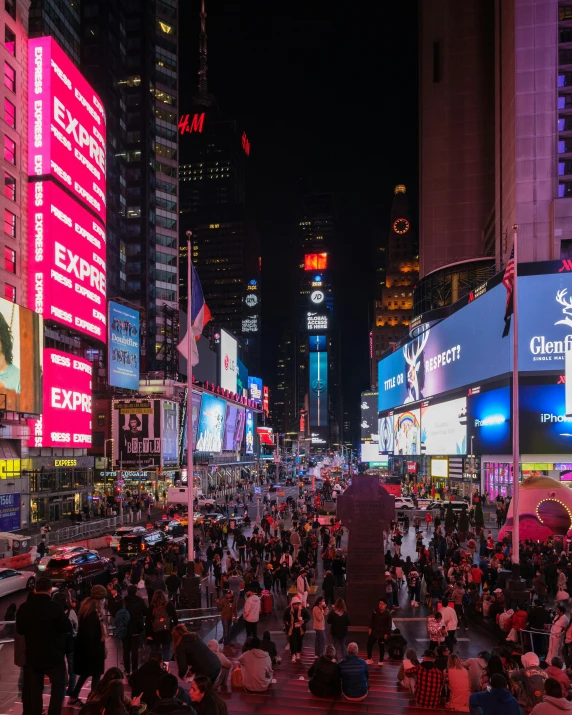 a city street with lights and a bunch of people