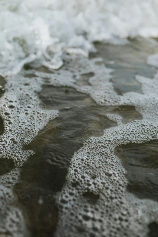 a close up of water with bubbles on it