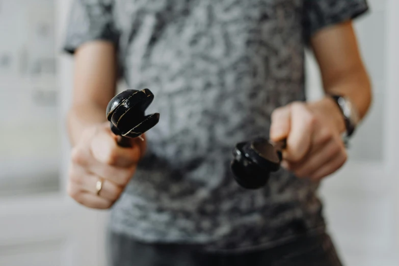 two people are holding up some type of black object