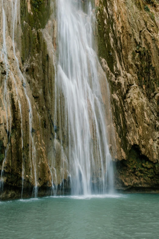 a waterfall in a body of water