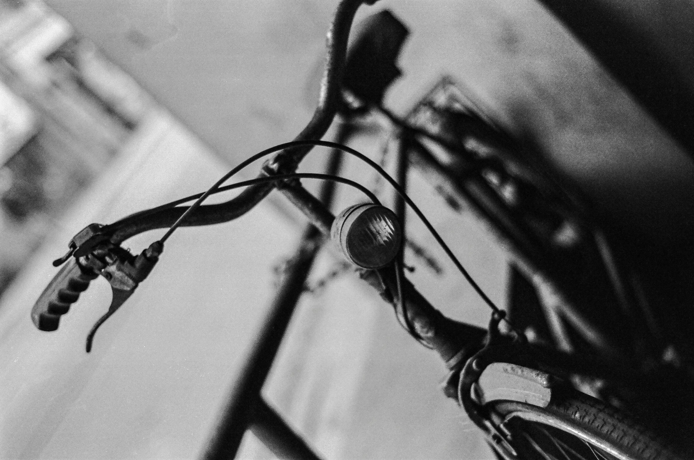 a bike parked next to a wall and some buildings