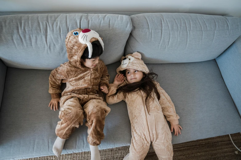 two little girls dressed up in animal pajamas