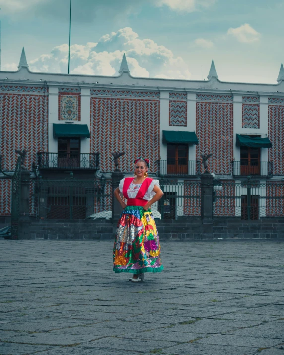 the woman is wearing a skirt that has an elaborate design