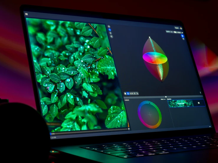 a laptop is turned on with colorful images