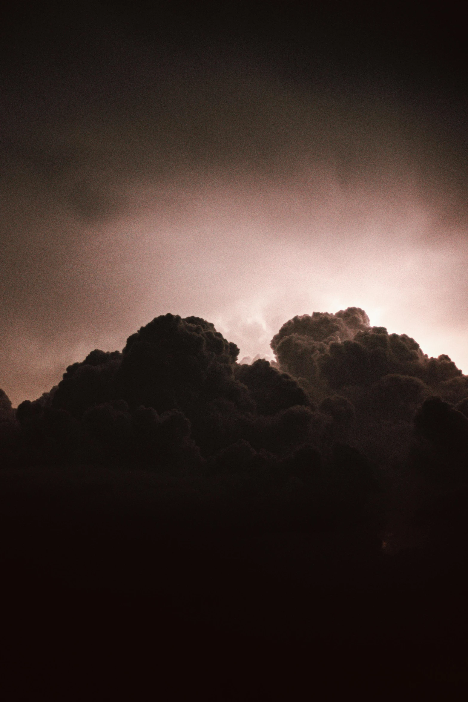 black and white clouds with dark orange colors