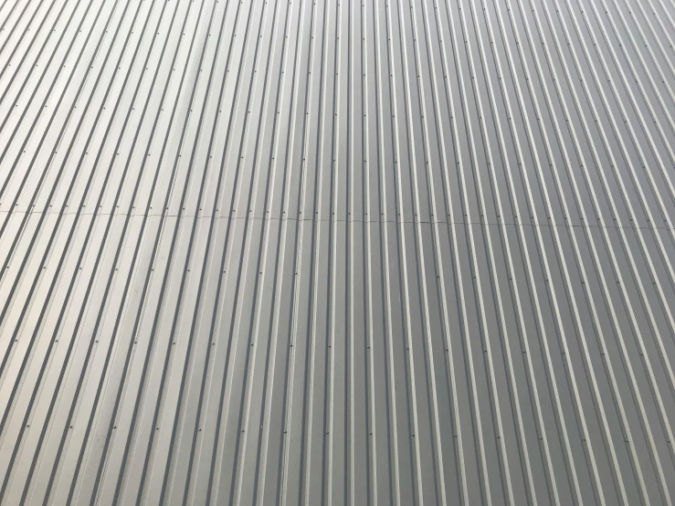 a building with a large strip of lines on the side