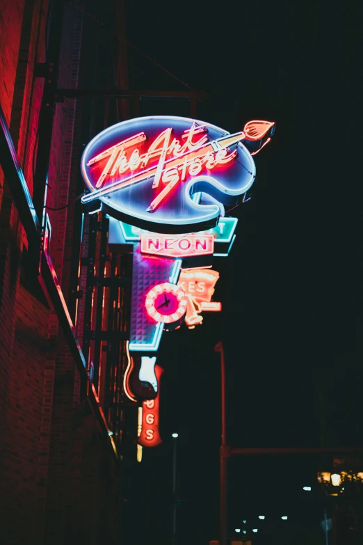 a neon sign for the american chopper store on the street