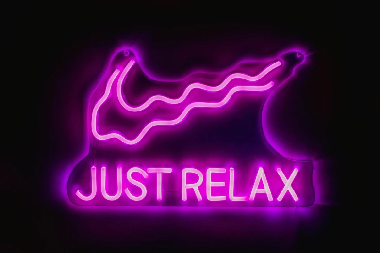 a neon sign that says just relax