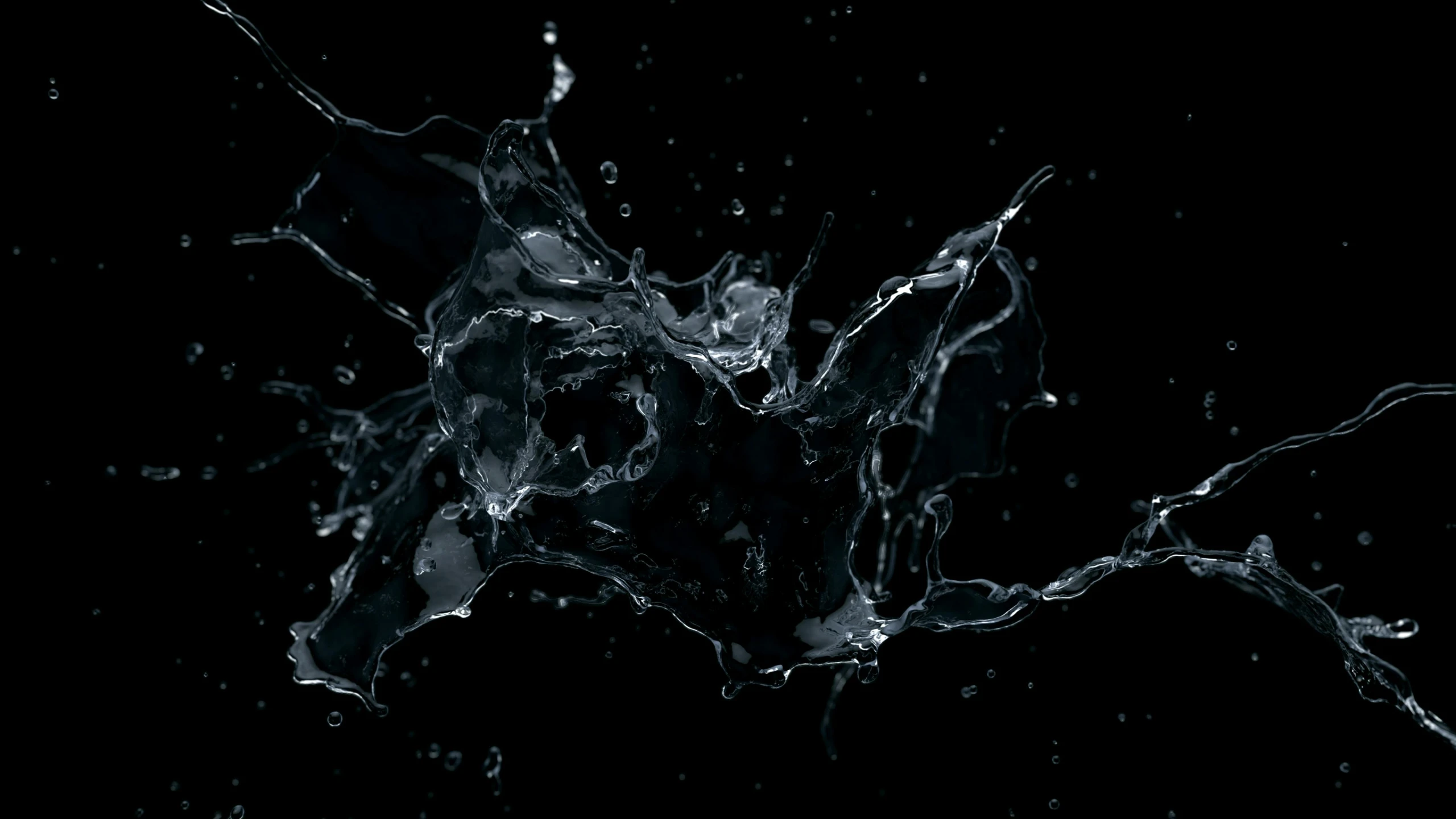 black and white image of water flying into the air