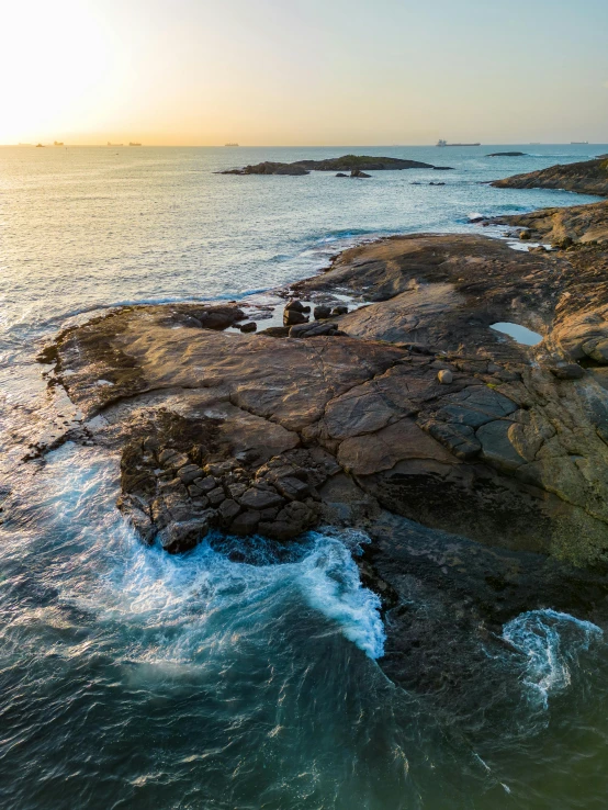 a rocky coastline and sea waves on the rocks