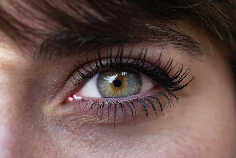 the eye of a woman with long eyelashes