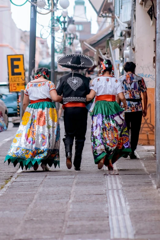 a group of people walking down a street