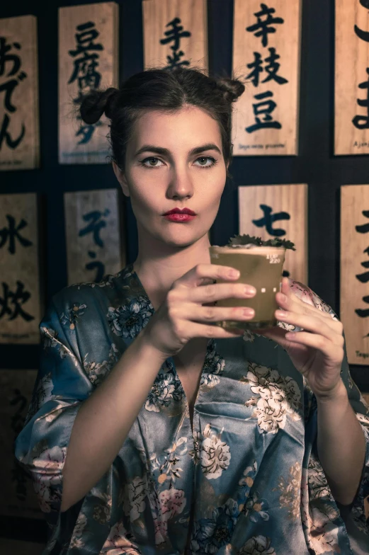 an oriental woman taking a selfie with a mirror