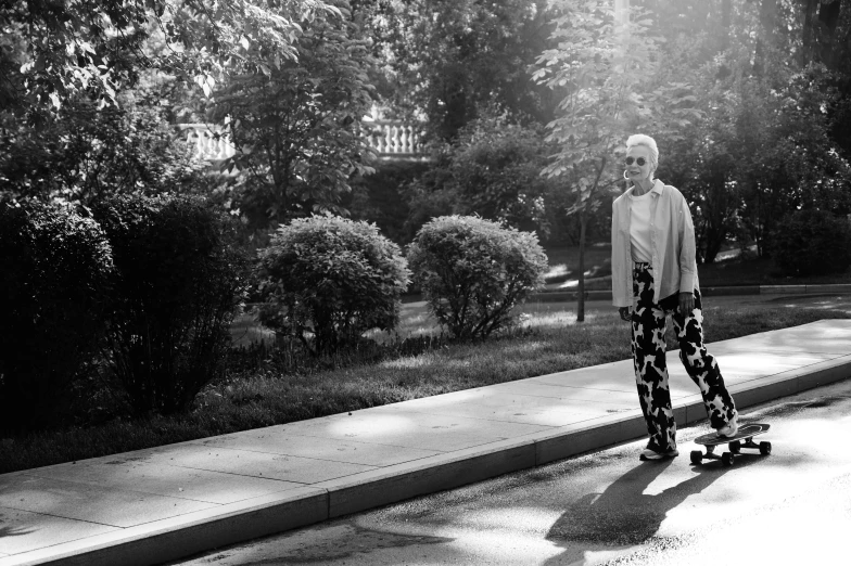 a person riding a skateboard near a park