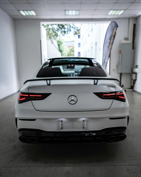 the back of a white mercedes benz sports car