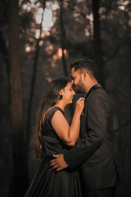 an image of a couple hugging and smiling