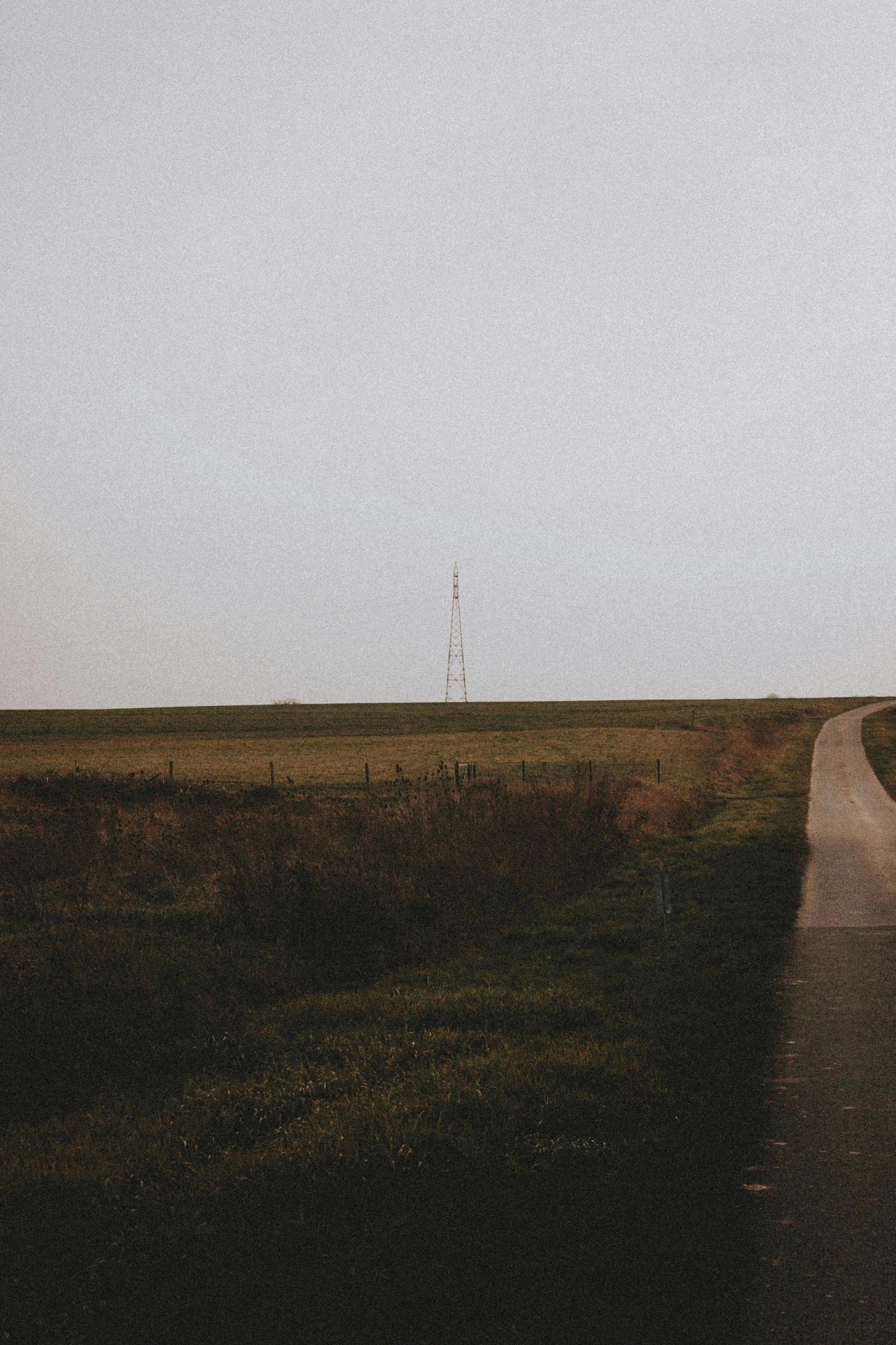 an image of a country road leading into the distance